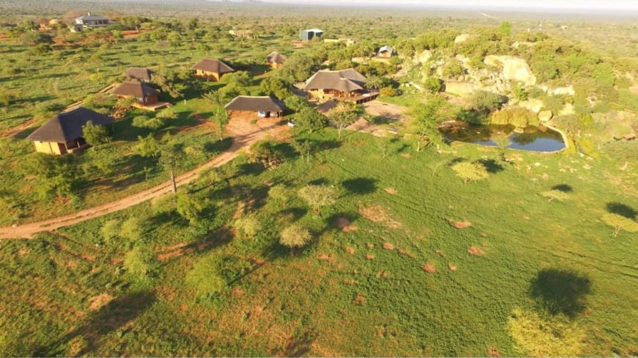 Aerial view of the camp and its waterhole in the surrounding bushveld